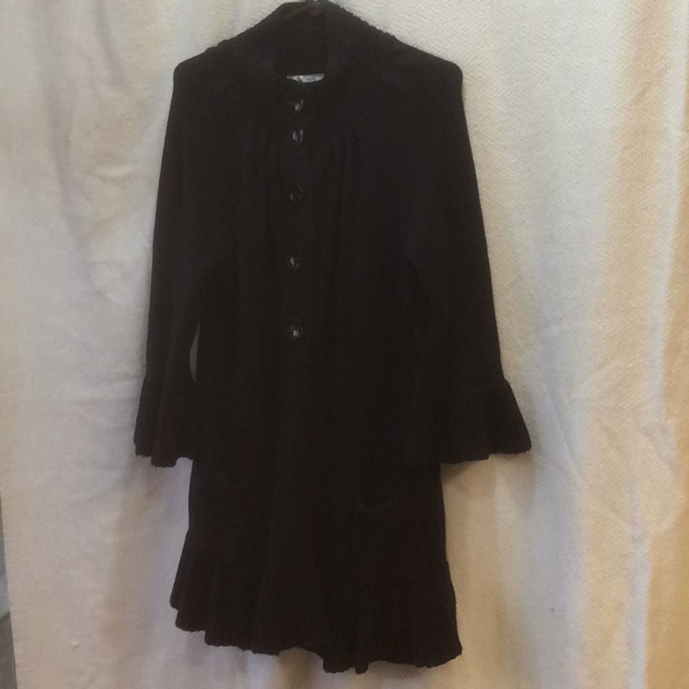 Ladies black ruffled sweater jacket.